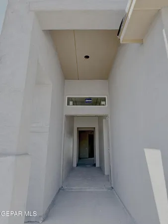 a view of an empty room with a fireplace