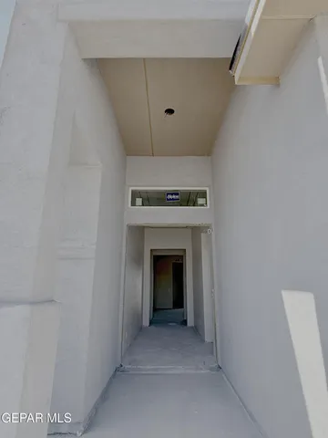 a view of an empty room with a fireplace