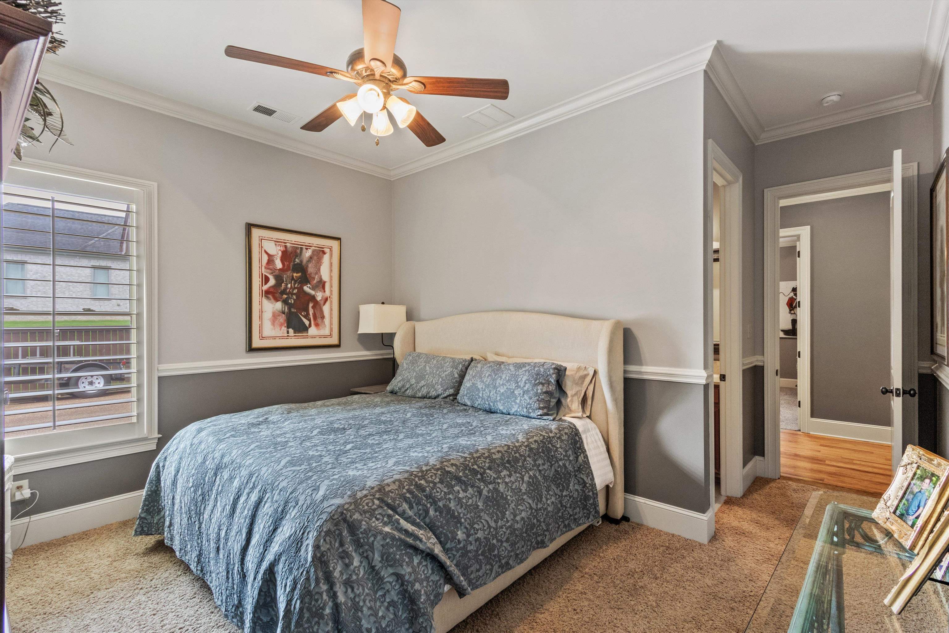 150 Ridgecrest Drive Arlington, TN 38002 - Photo 26 of 40 Carpeted bedroom featuring two-tone walls with chair rail molding and crown molding