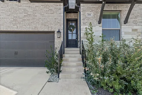 a potted plant sitting in front of a building