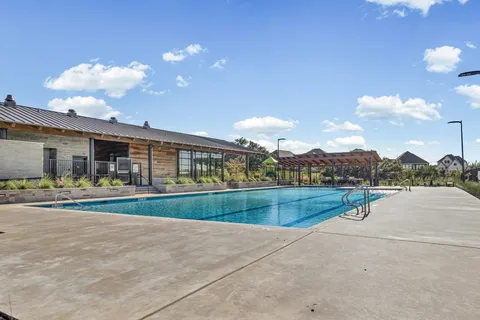 a view of swimming pool is middle in the middle of a building