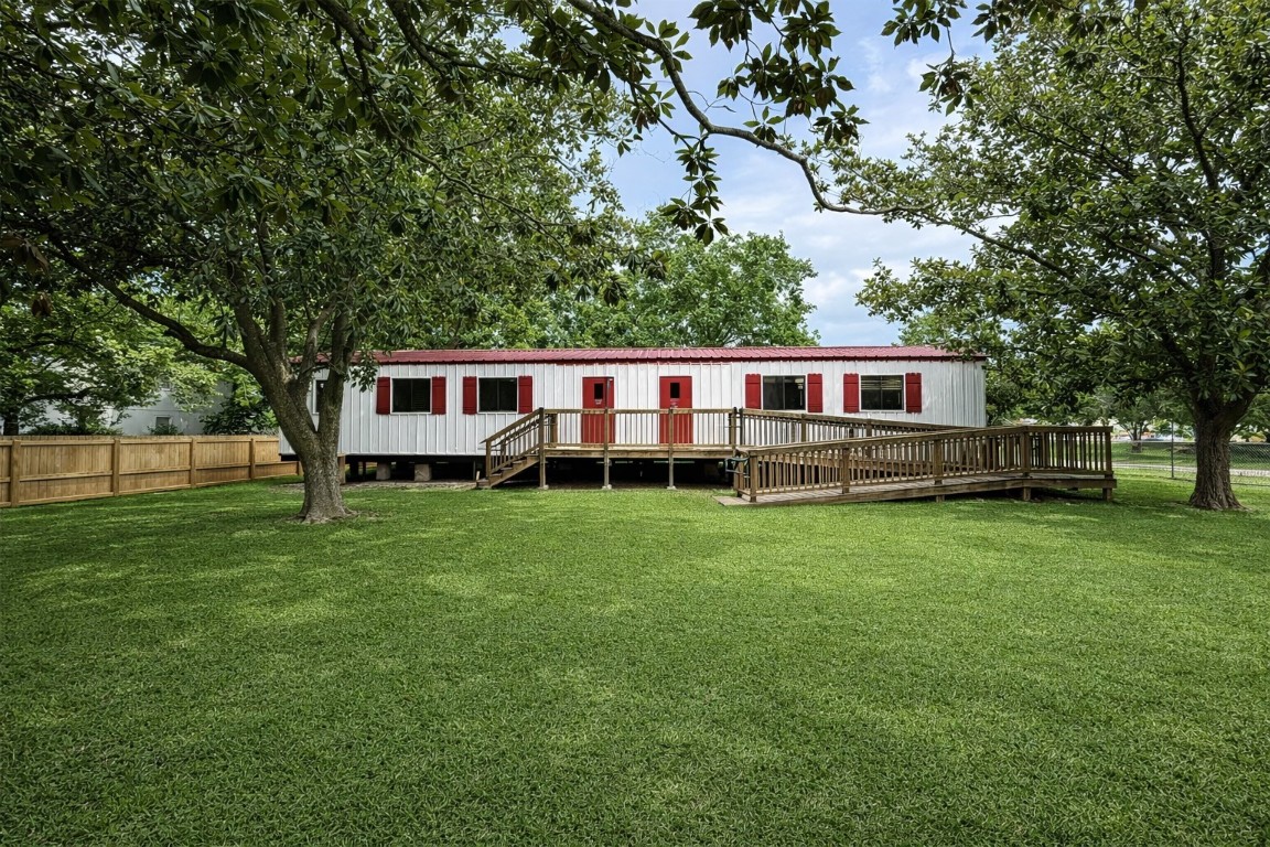 817 Walnut Wharton, TX 77488 - Photo 2 of 10 a view of a house with backyard and garden
