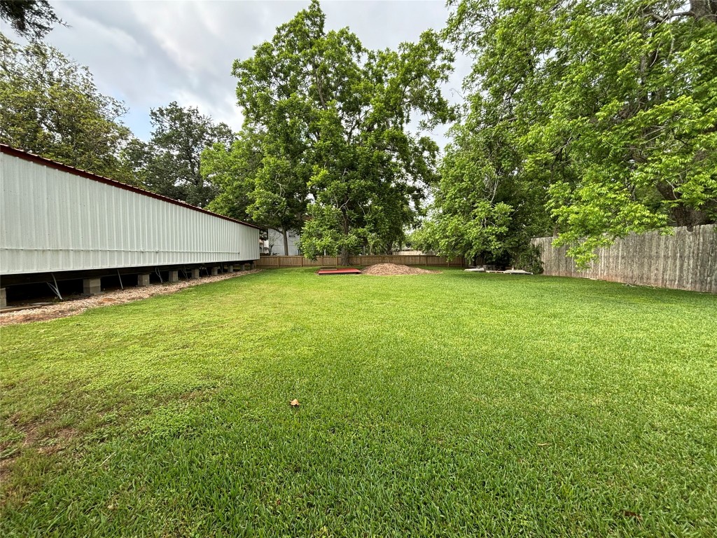 817 Walnut Wharton, TX 77488 - Photo 9 of 10 a backyard of a house with lots of green space