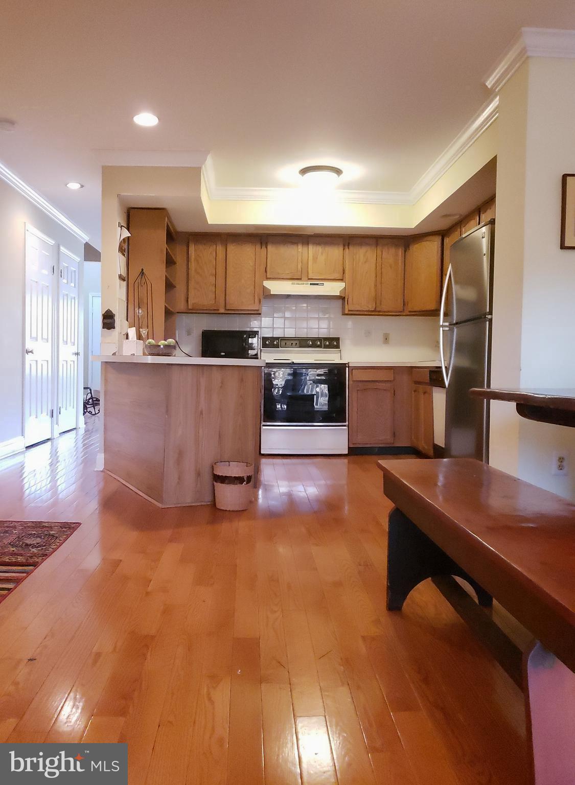 504 Williamson Circle Media, PA 19063 - Photo 11 of 33 a view of kitchen with kitchen island microwave and stove