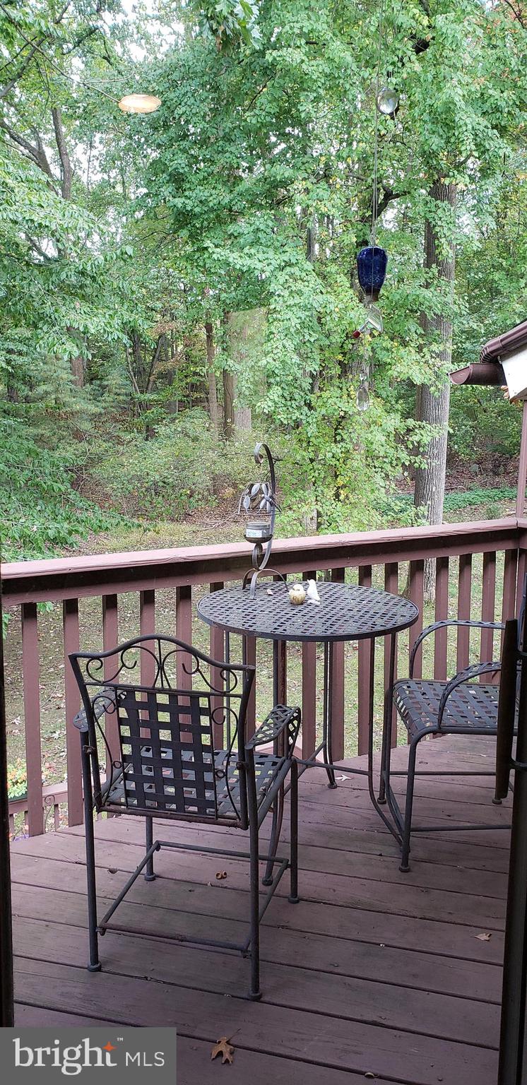 504 Williamson Circle Media, PA 19063 - Photo 20 of 33 a view of a chairs and table on the wooden deck