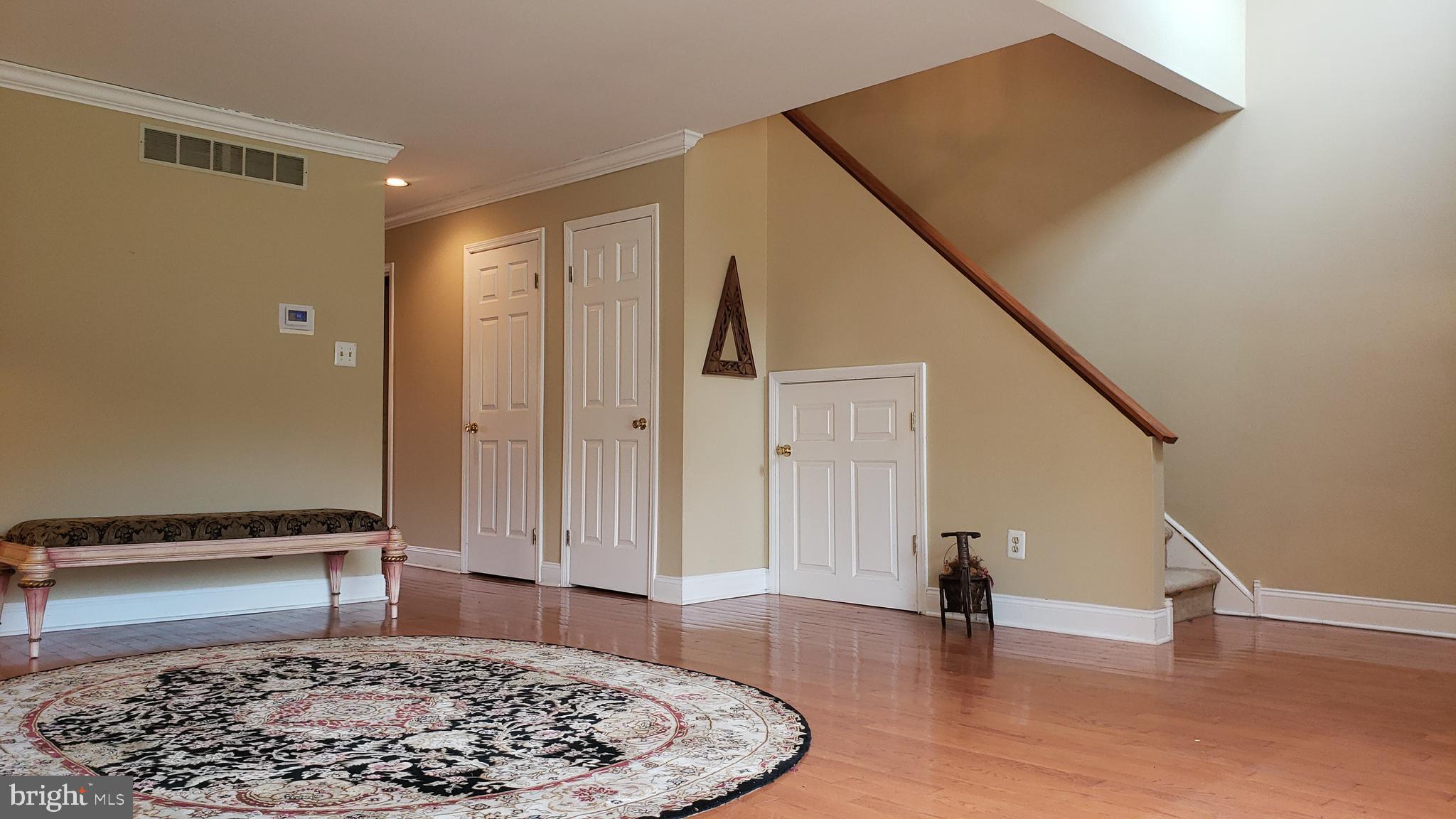 504 Williamson Circle Media, PA 19063 - Photo 6 of 33 a view of a hallway with wooden floor and stairs