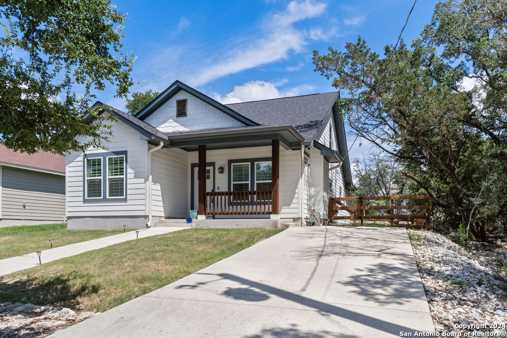 1125 Cedar Grove Trail Spring Branch, TX 78070 - Photo 1 of 23 a front view of a house with a yard and potted plants