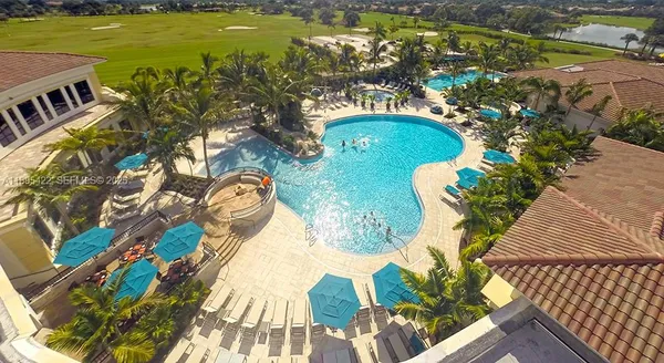 a view of swimming pool yard with outdoor seating