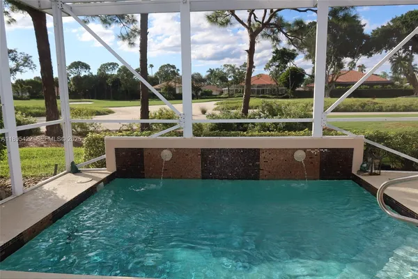 a view of a house with a big yard and potted plants