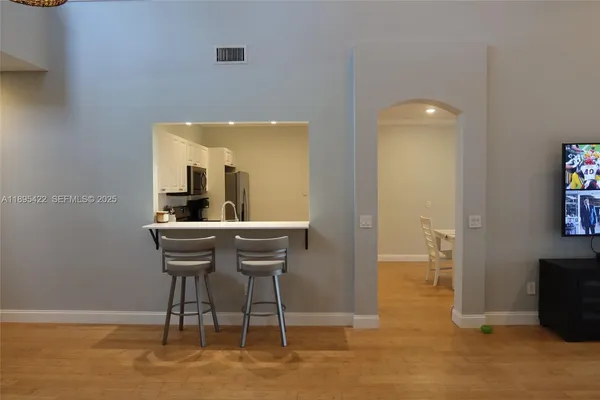 a dining room with furniture and window