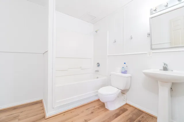 a bathroom with a toilet and a sink