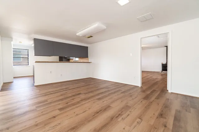 a view of a livingroom with wooden floor