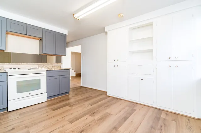 a kitchen with a stove oven and sink