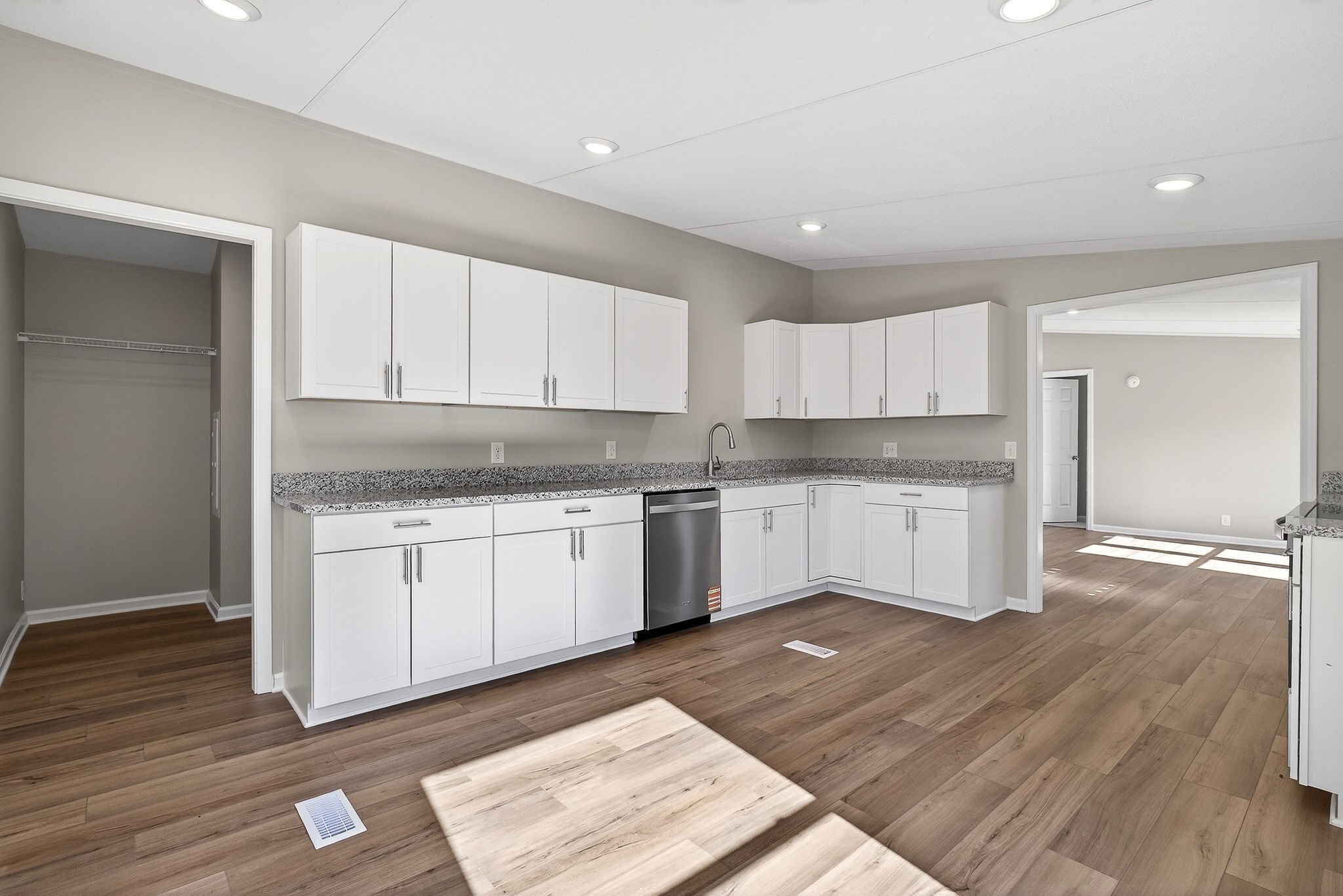 593 Cedar Bend Road Beechgrove, TN 37018 - Photo 12 of 38 a kitchen with granite countertop white cabinets and white appliances