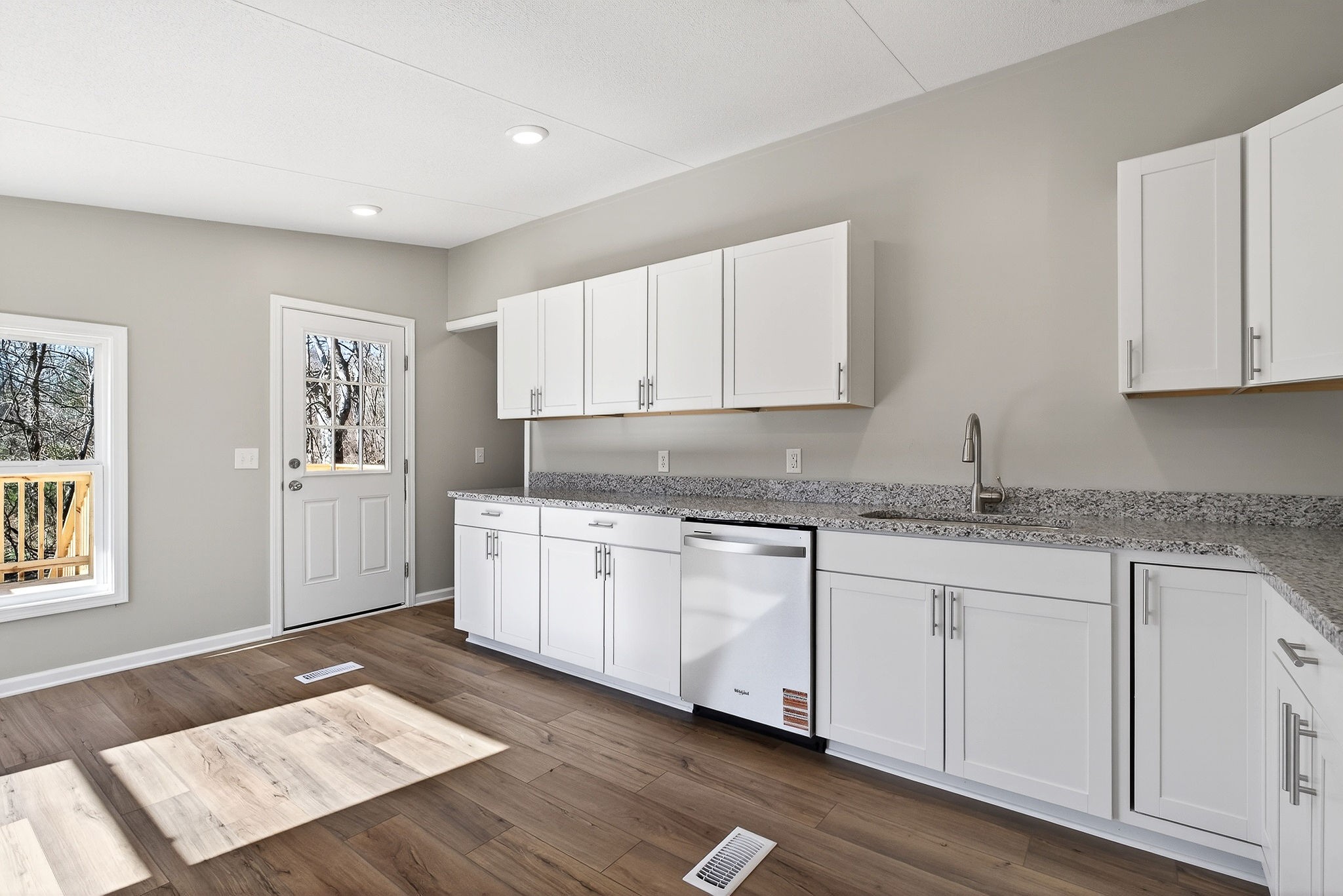 593 Cedar Bend Road Beechgrove, TN 37018 - Photo 13 of 38 a kitchen with granite countertop cabinets stainless steel appliances and a wooden floor