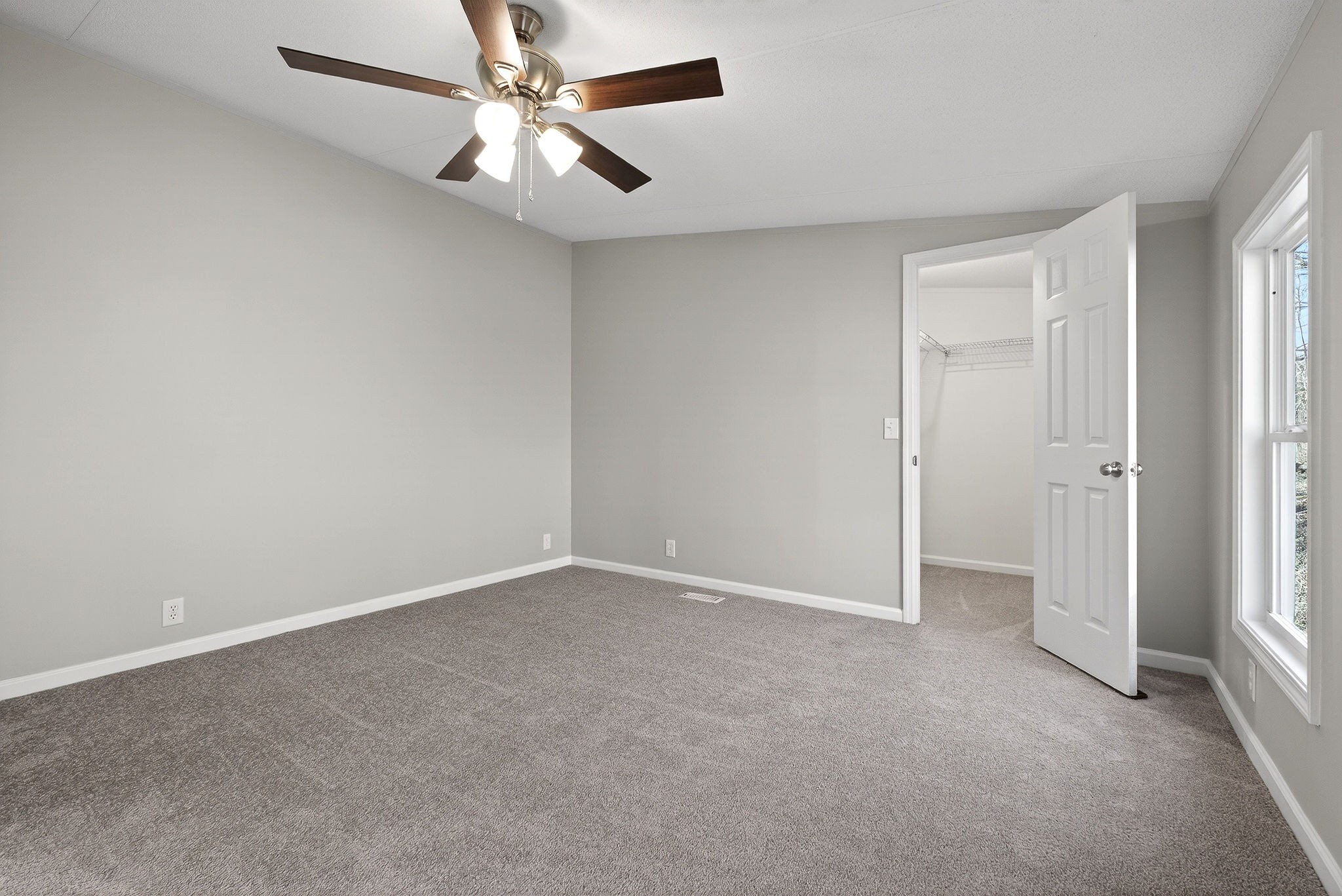 593 Cedar Bend Road Beechgrove, TN 37018 - Photo 16 of 38 an empty room with a ceiling fan and a window
