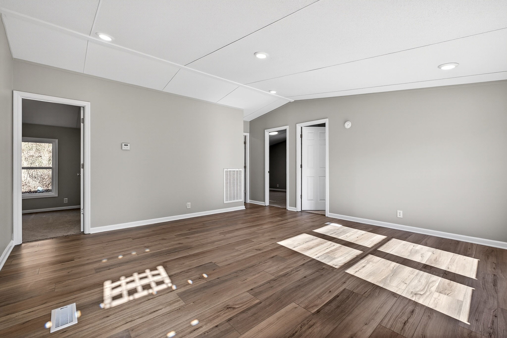 593 Cedar Bend Road Beechgrove, TN 37018 - Photo 2 of 38 wooden floor in an empty room with a window