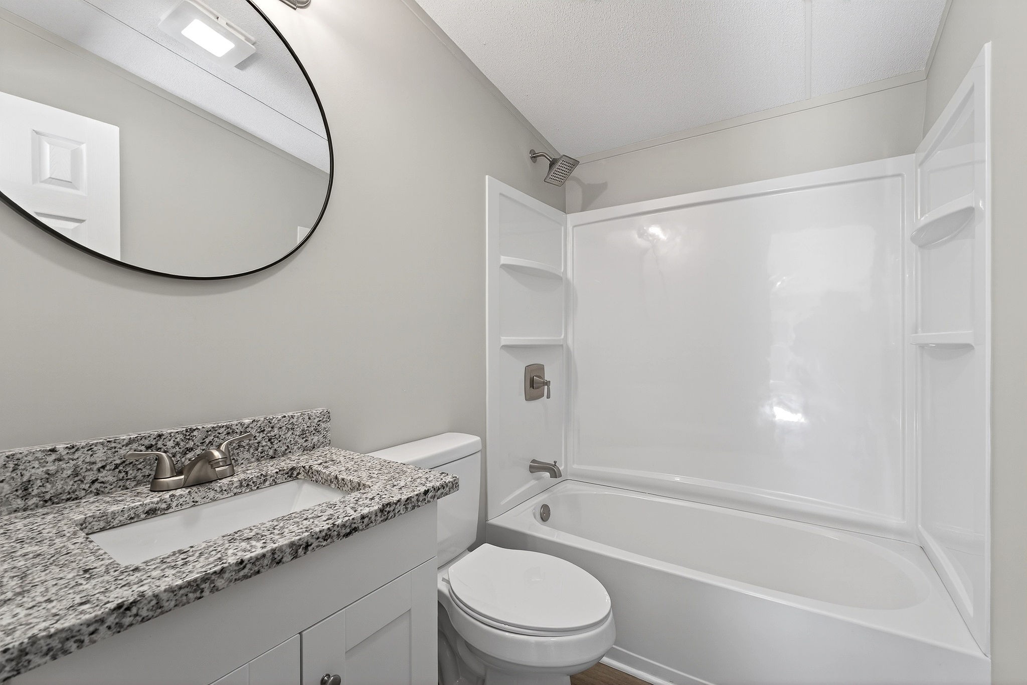 593 Cedar Bend Road Beechgrove, TN 37018 - Photo 7 of 38 a bathroom with a granite countertop sink toilet and shower
