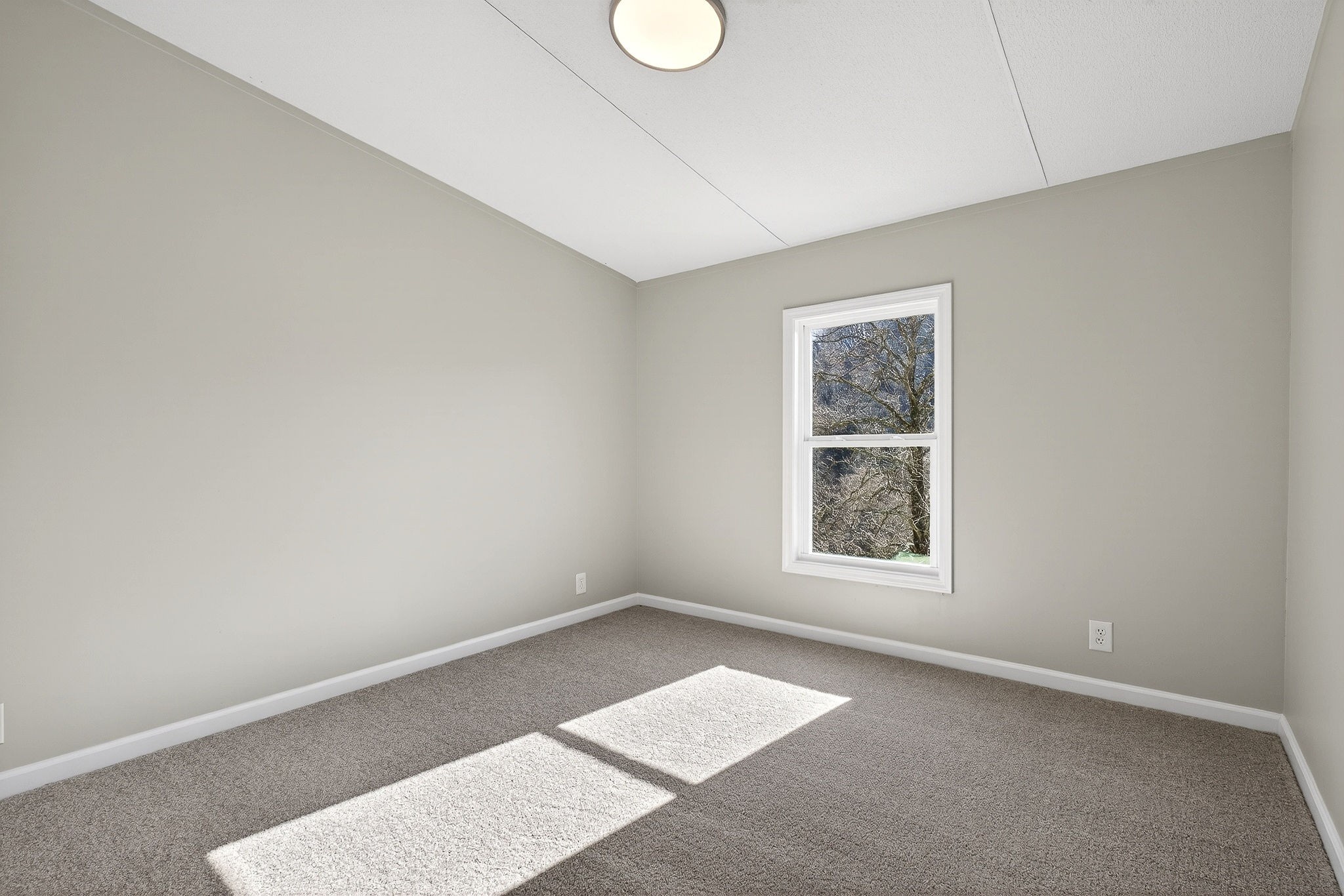 593 Cedar Bend Road Beechgrove, TN 37018 - Photo 8 of 38 a view of an empty room with a window