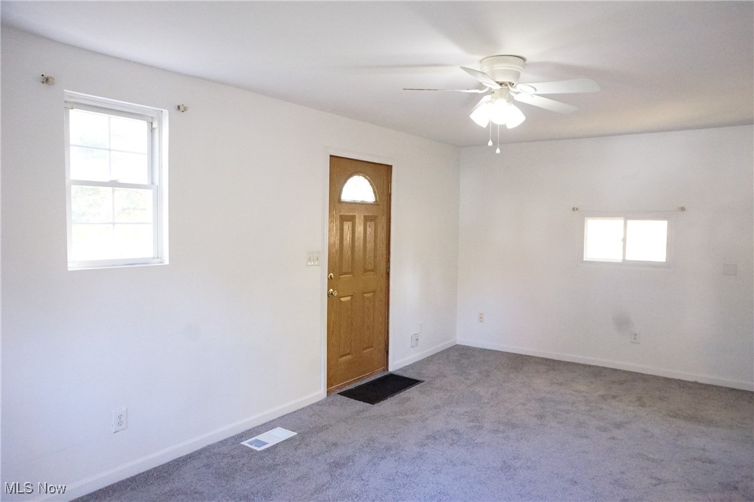 3276 Cottage Grove Road Akron, OH 44319 - Photo 7 of 18 Living room view 3 of 3 facing front door. New carpet and paint!