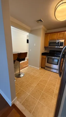 a room with wooden floor and furniture