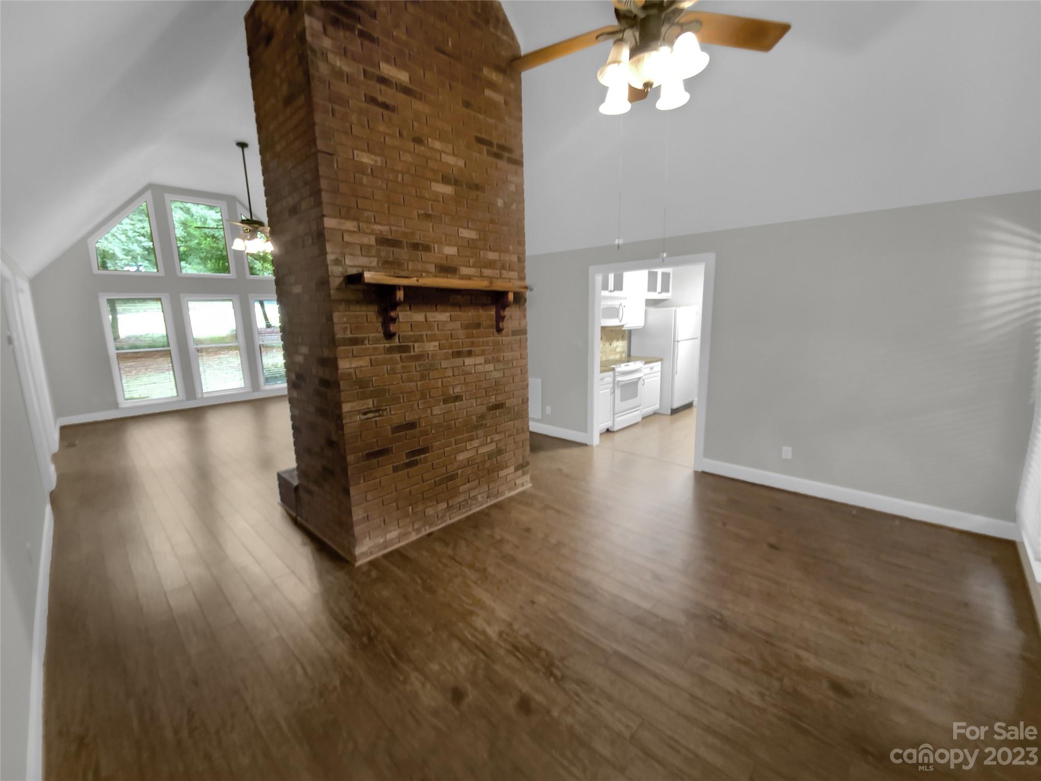 3618 Griffith Road Monroe, NC 28112 - Photo 8 of 16 wooden floor in an empty room with a window