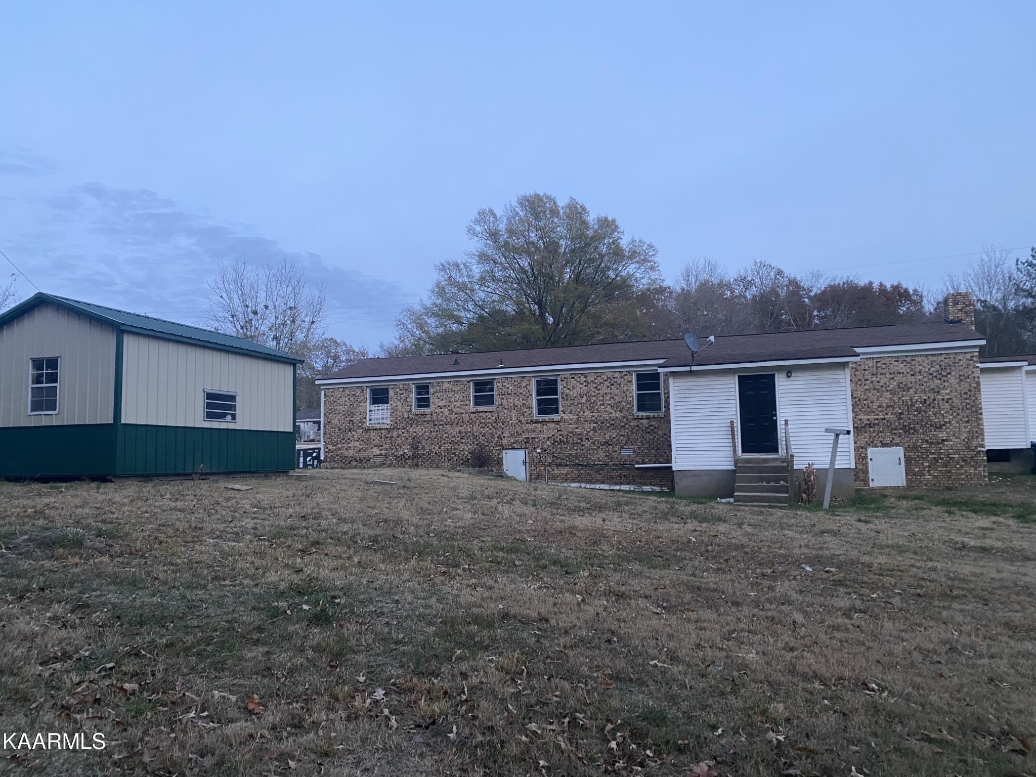 3575 Foundry Hill Road Puryear, TN 38251 - Photo 12 of 13 a view of a house with a yard
