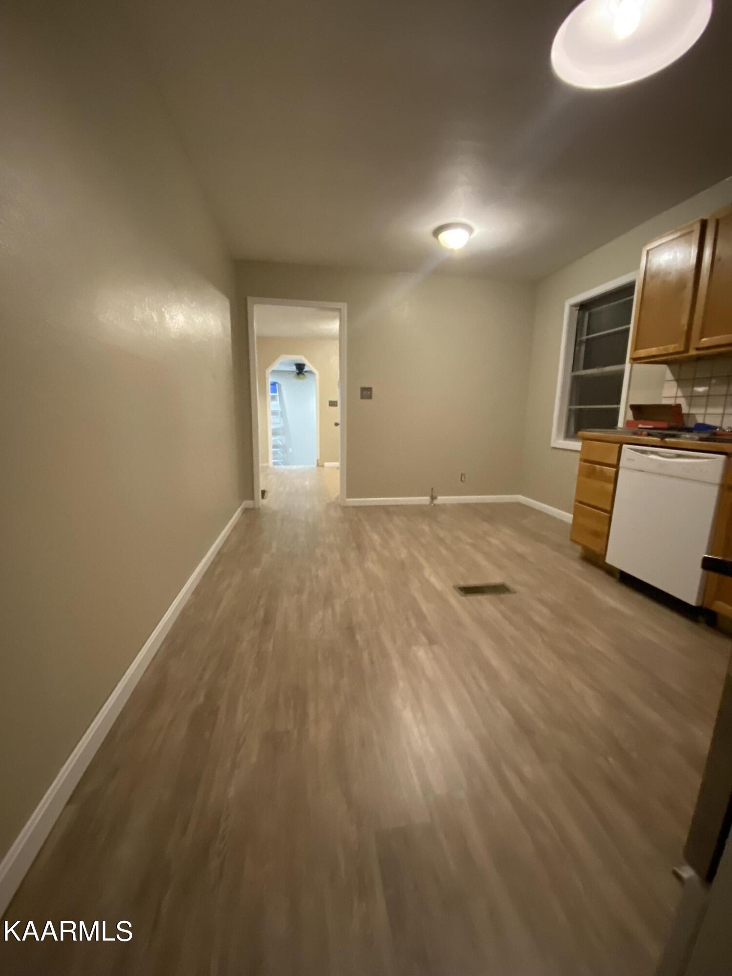 3575 Foundry Hill Road Puryear, TN 38251 - Photo 3 of 13 a view of a kitchen with wooden floor and a sink
