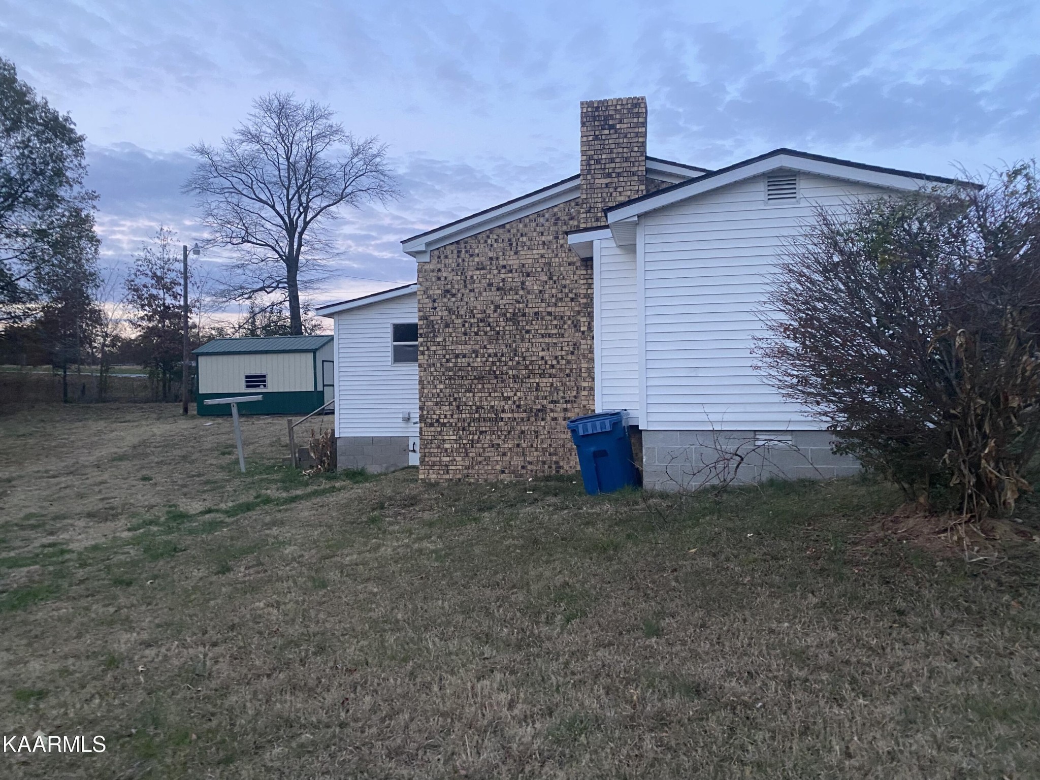 3575 Foundry Hill Road Puryear, TN 38251 - Photo 10 of 13 a front view of a house with a yard