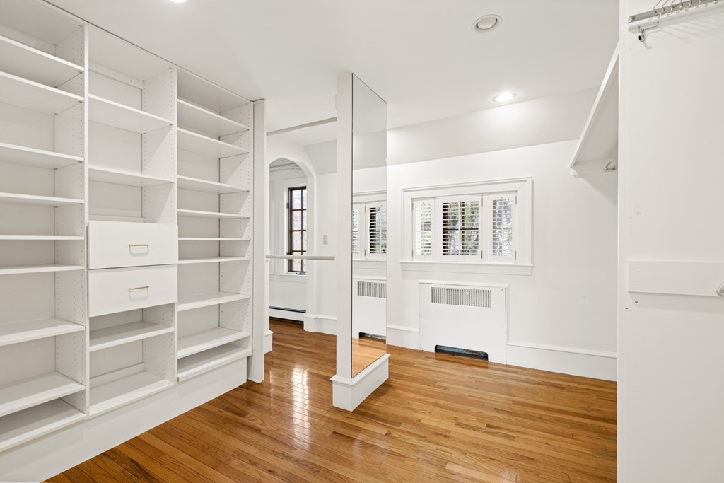 77 Hallwood Road Brookline, MA 02467 - Photo 27 of 42 a view of an empty room with wooden floor and a window