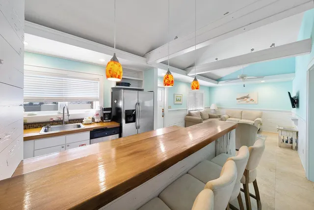 a kitchen with stainless steel appliances granite countertop a sink and counter space