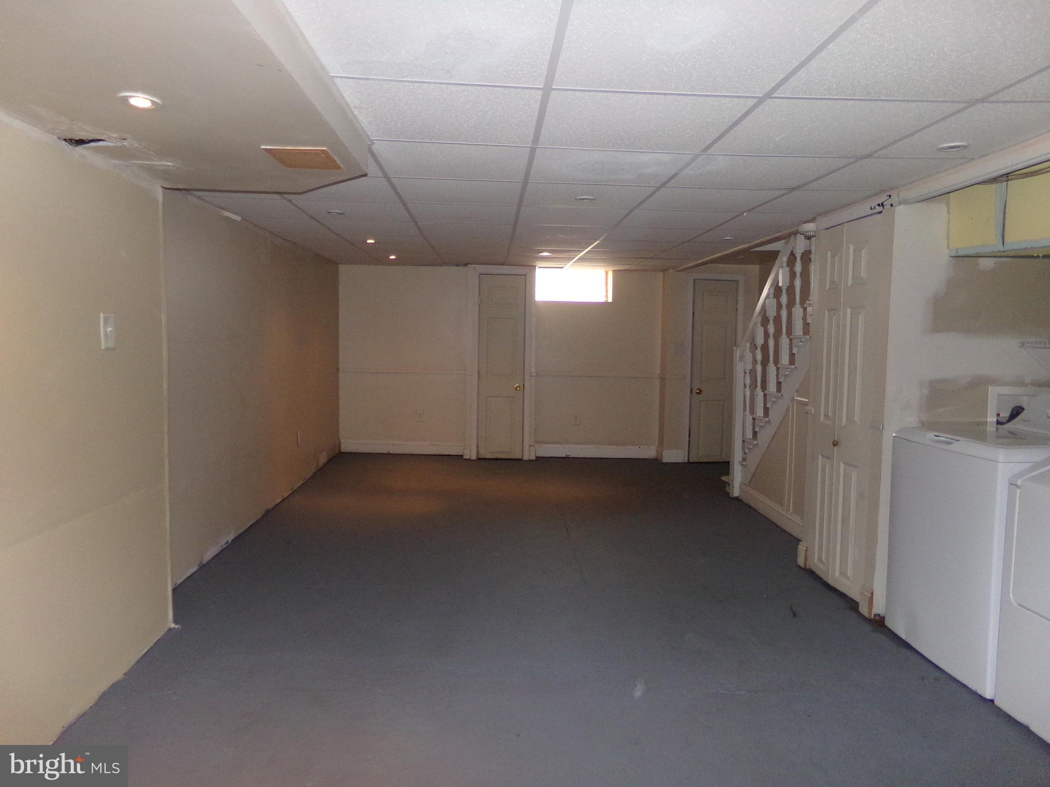 26 Concord Road Darby, PA 19023 - Photo 31 of 37 Semi finished basement with laundry area