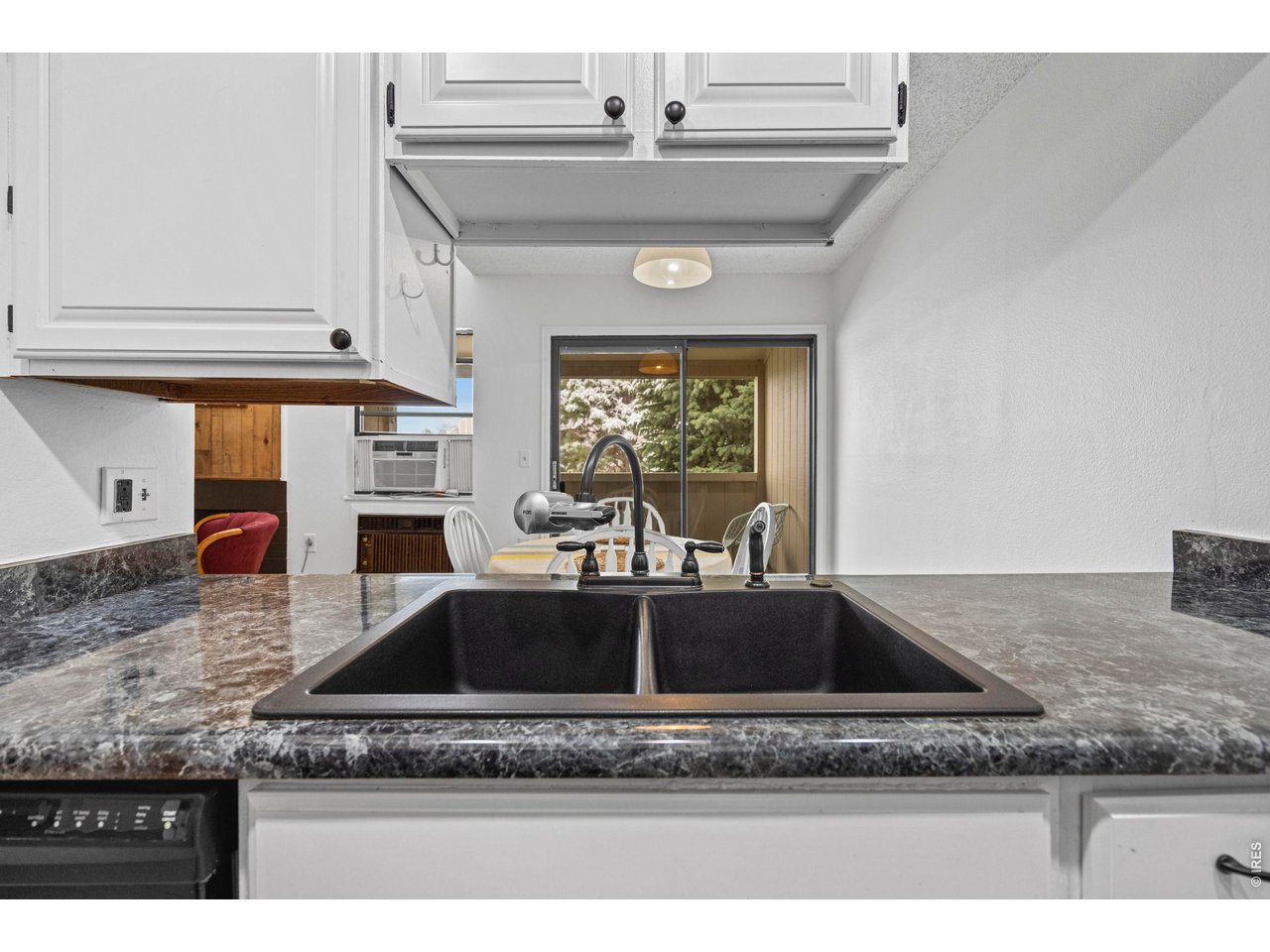 3400 Stanford Road, Unit B223 Fort Collins, CO 80525 - Photo 18 of 34 a kitchen with stainless steel appliances granite countertop a sink a refrigerator and granite counter tops