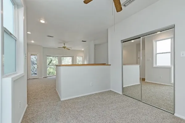 a bathroom with a sink double vanity granite tub shower and a mirror
