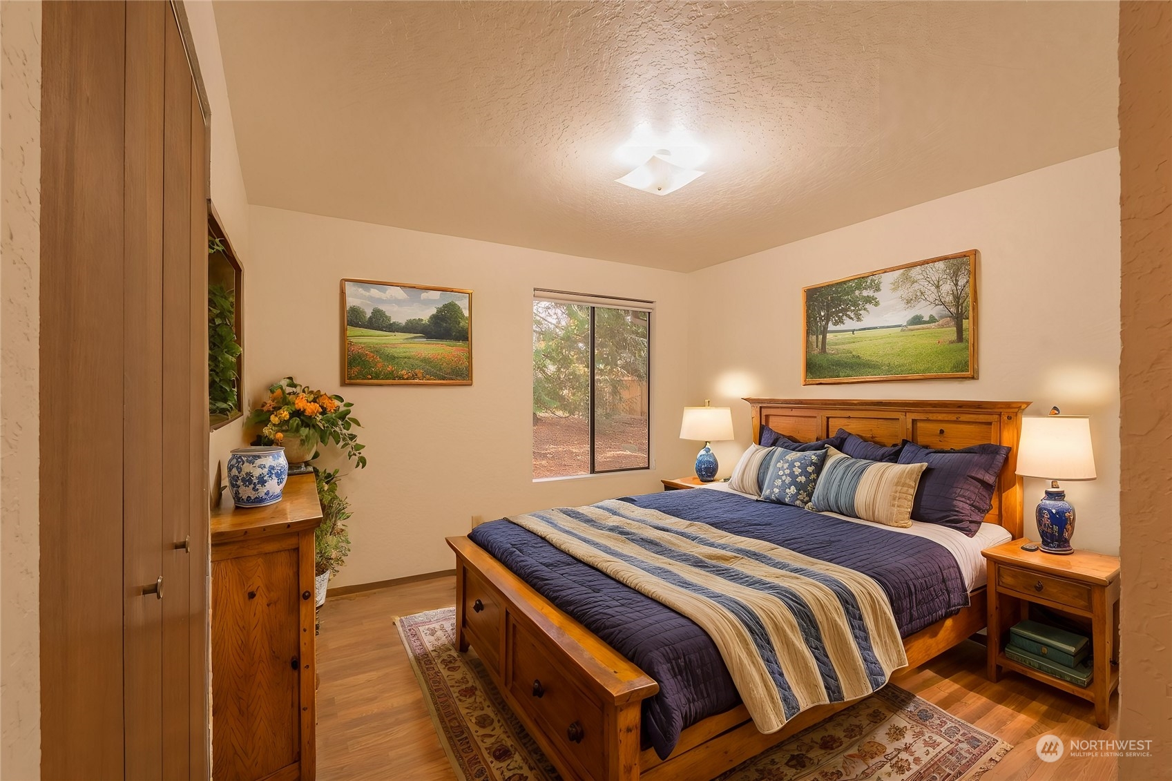 19628 35th Avenue Southeast Bothell, WA 98012 - Photo 18 of 31 a bedroom with a bed and a painting on the wall