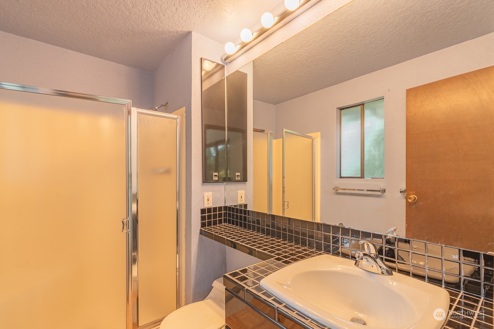19628 35th Avenue Southeast Bothell, WA 98012 - Photo 19 of 31 a bathroom with a sink and a mirror