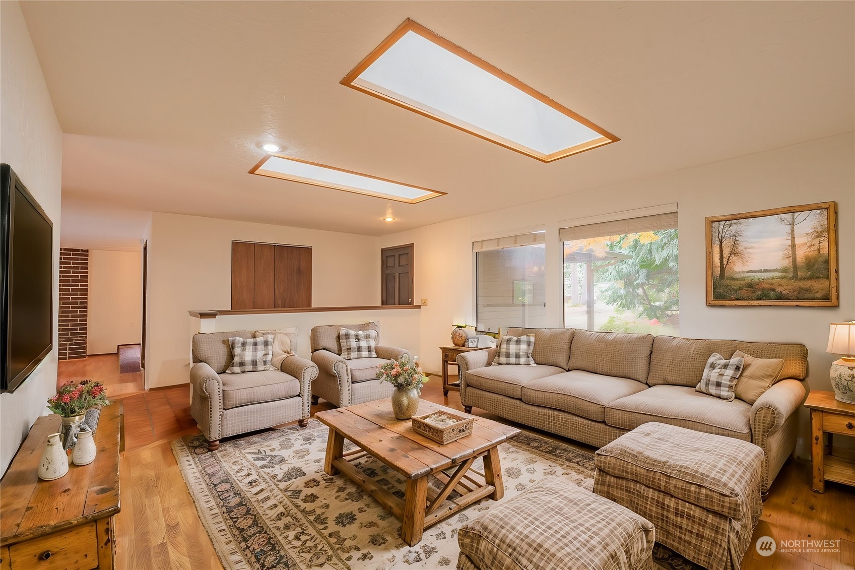 19628 35th Avenue Southeast Bothell, WA 98012 - Photo 5 of 31 a living room with furniture and a flat screen tv