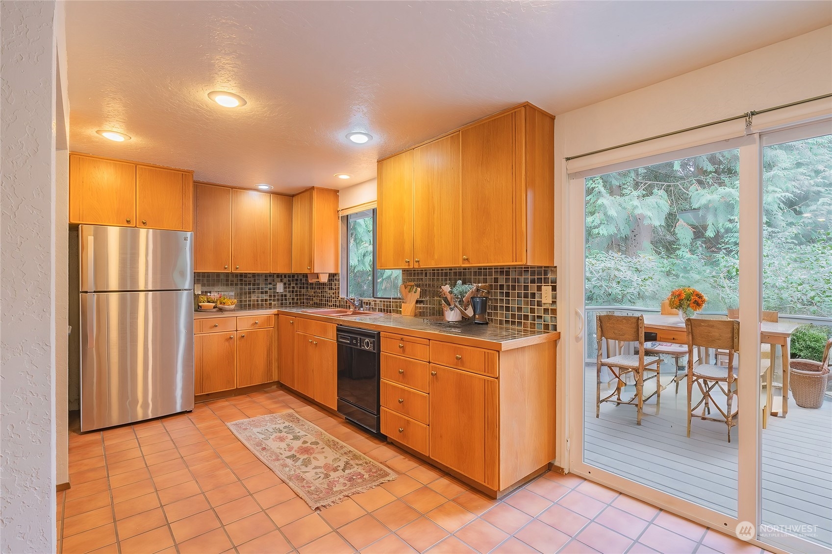 19628 35th Avenue Southeast Bothell, WA 98012 - Photo 8 of 31 a kitchen with stainless steel appliances granite countertop a refrigerator and a stove top oven