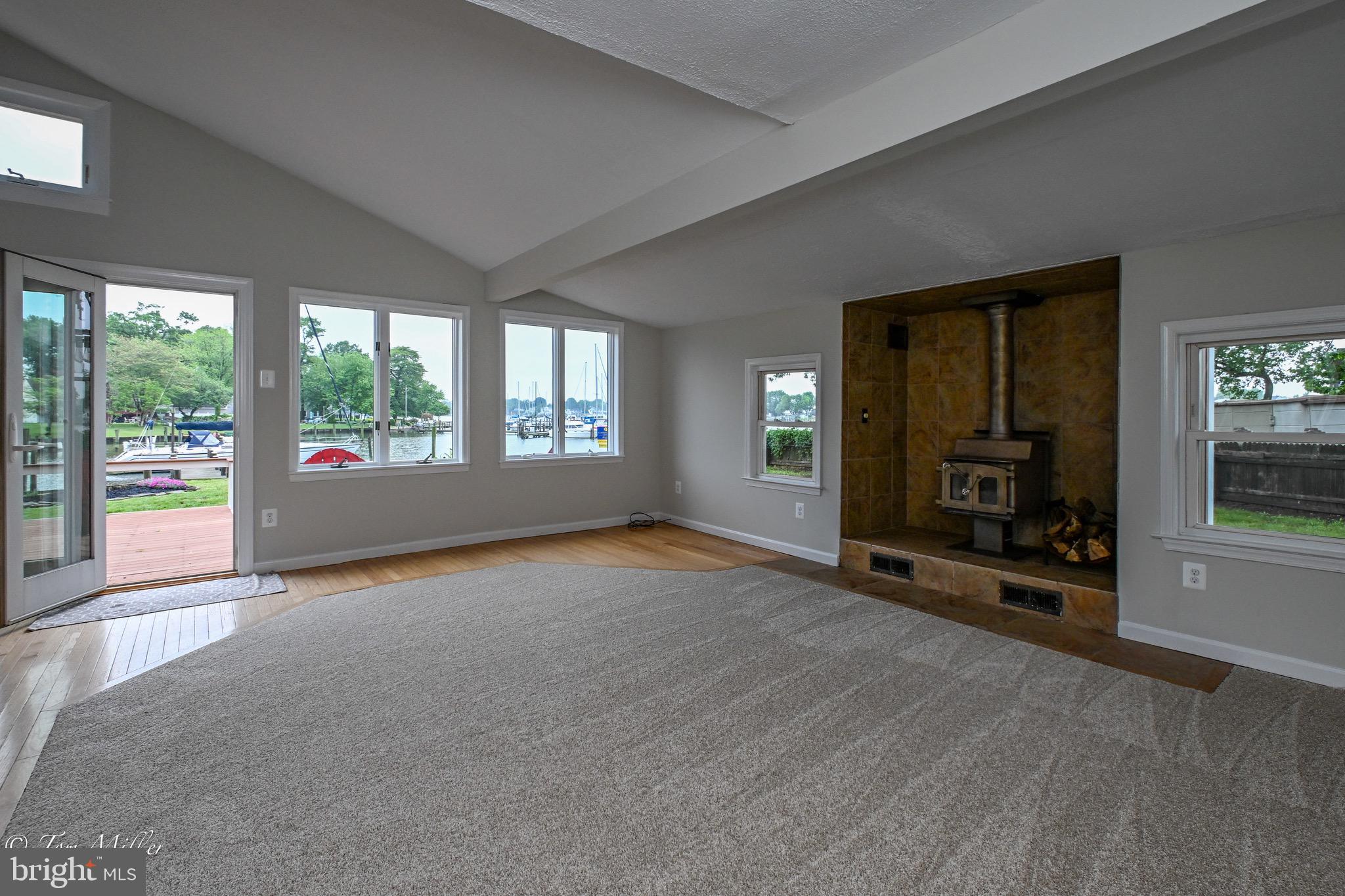 1135 Beech Drive Baltimore, MD 21220 - Photo 11 of 53 an empty room with furniture and a fireplace