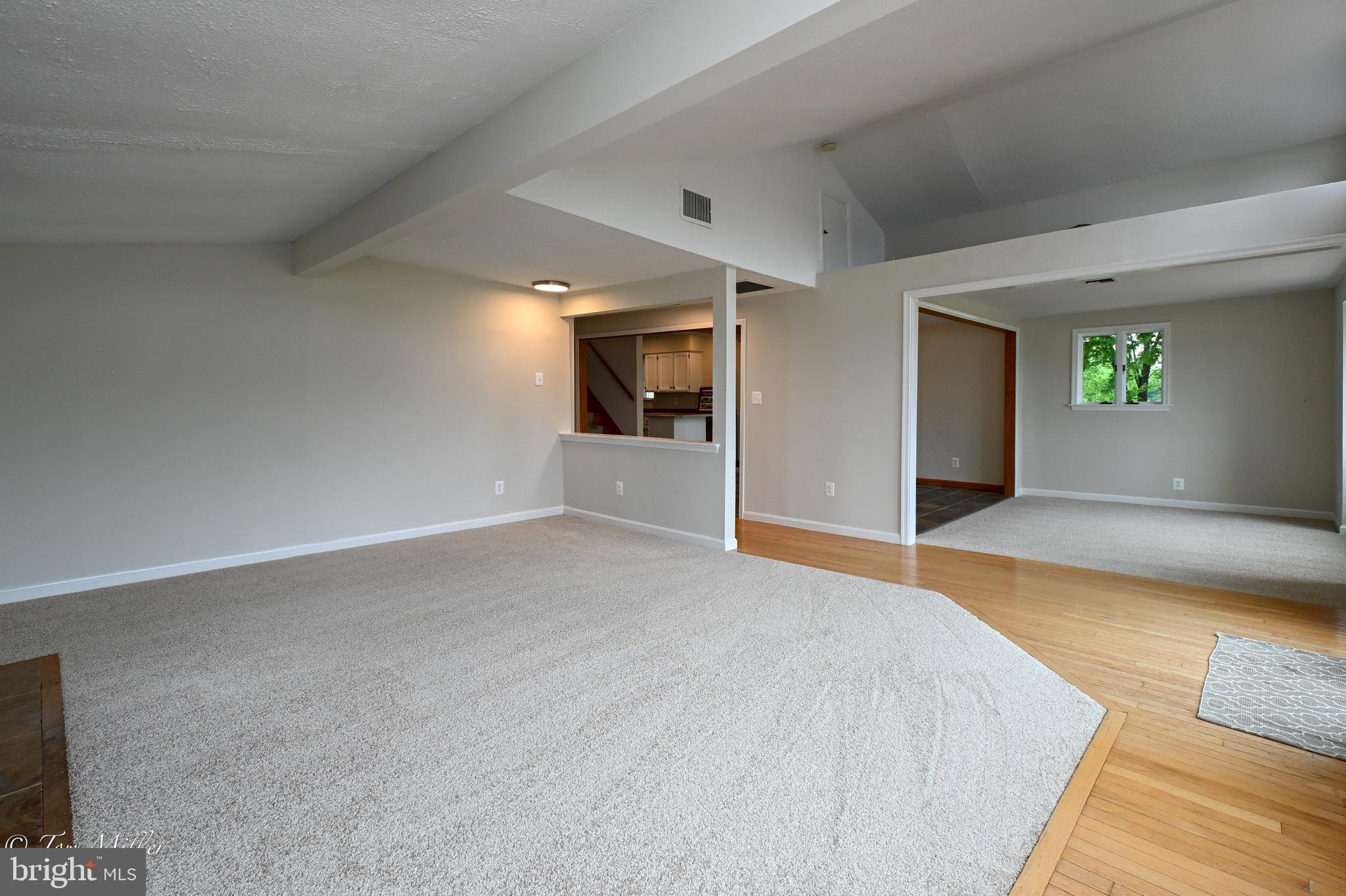 1135 Beech Drive Baltimore, MD 21220 - Photo 13 of 53 a spacious bedroom with a bed and a flat screen tv