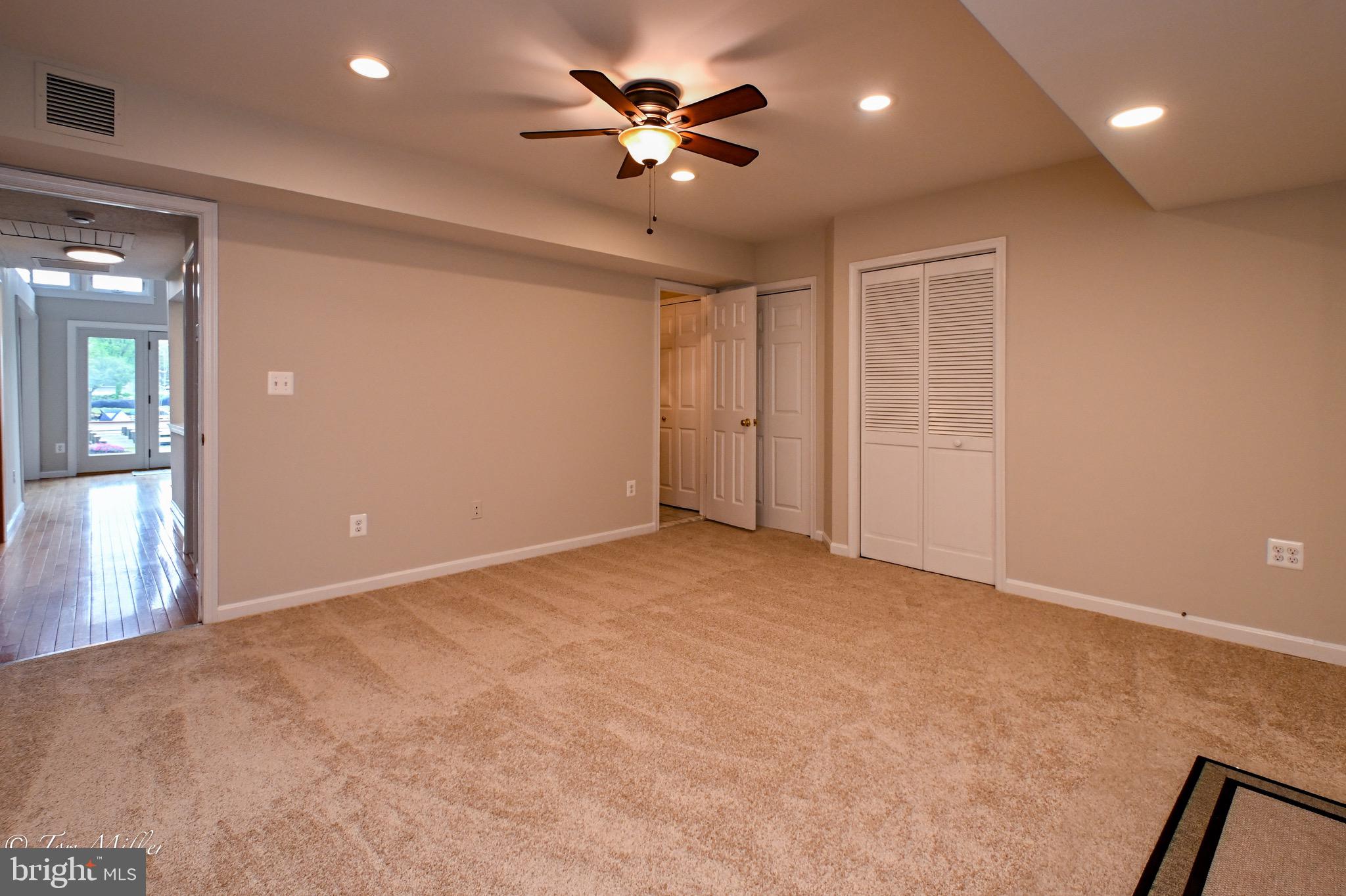 1135 Beech Drive Baltimore, MD 21220 - Photo 21 of 53 a view of an empty room with a ceiling fan