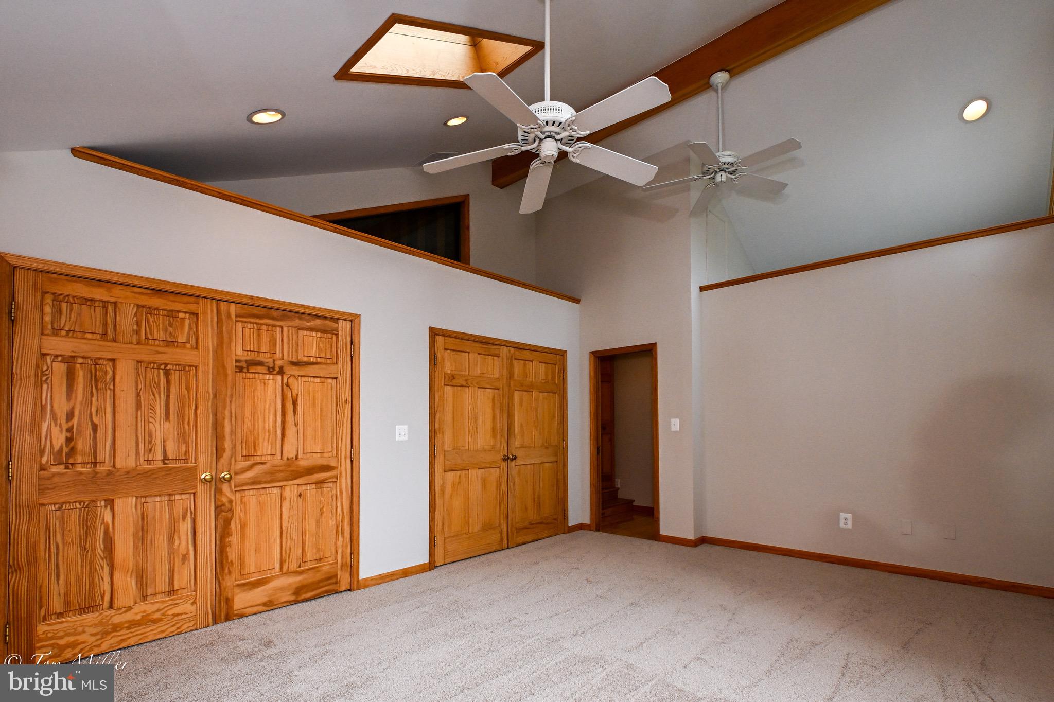 1135 Beech Drive Baltimore, MD 21220 - Photo 28 of 53 an empty room with windows & fan