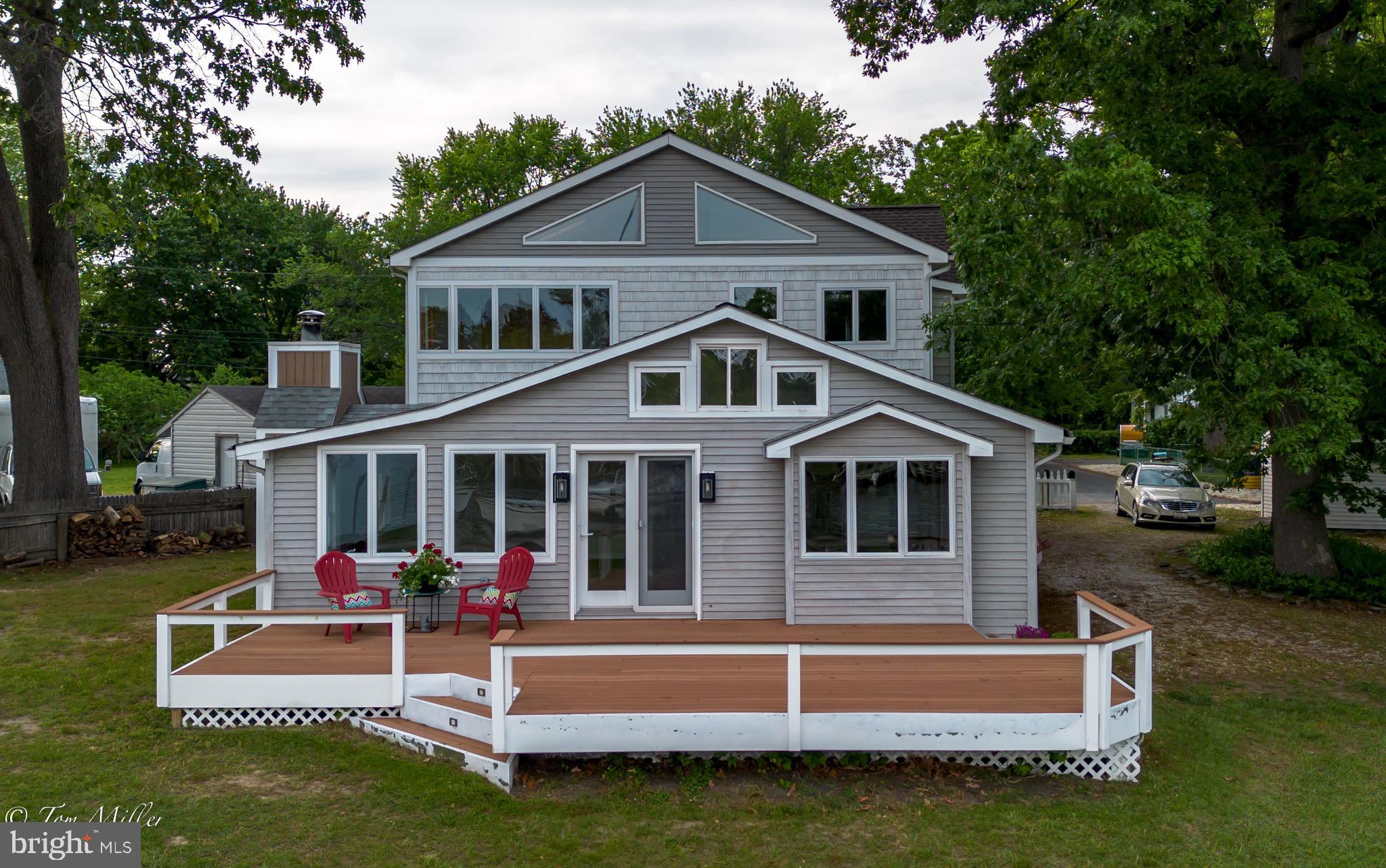 1135 Beech Drive Baltimore, MD 21220 - Photo 3 of 53 a view of a house with a yard porch and wooden fence