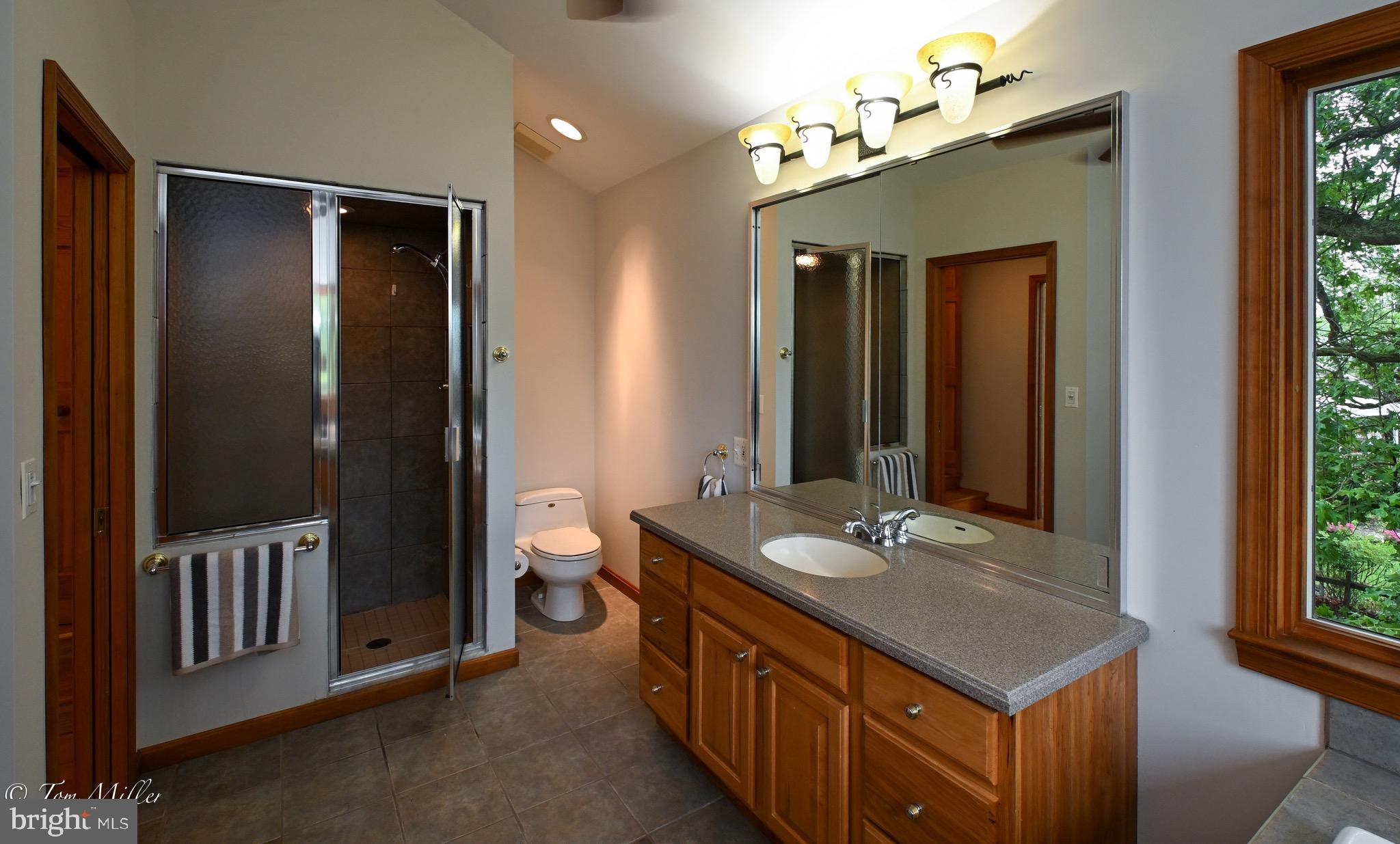 1135 Beech Drive Baltimore, MD 21220 - Photo 31 of 53 a bathroom with a double vanity sink and a mirror