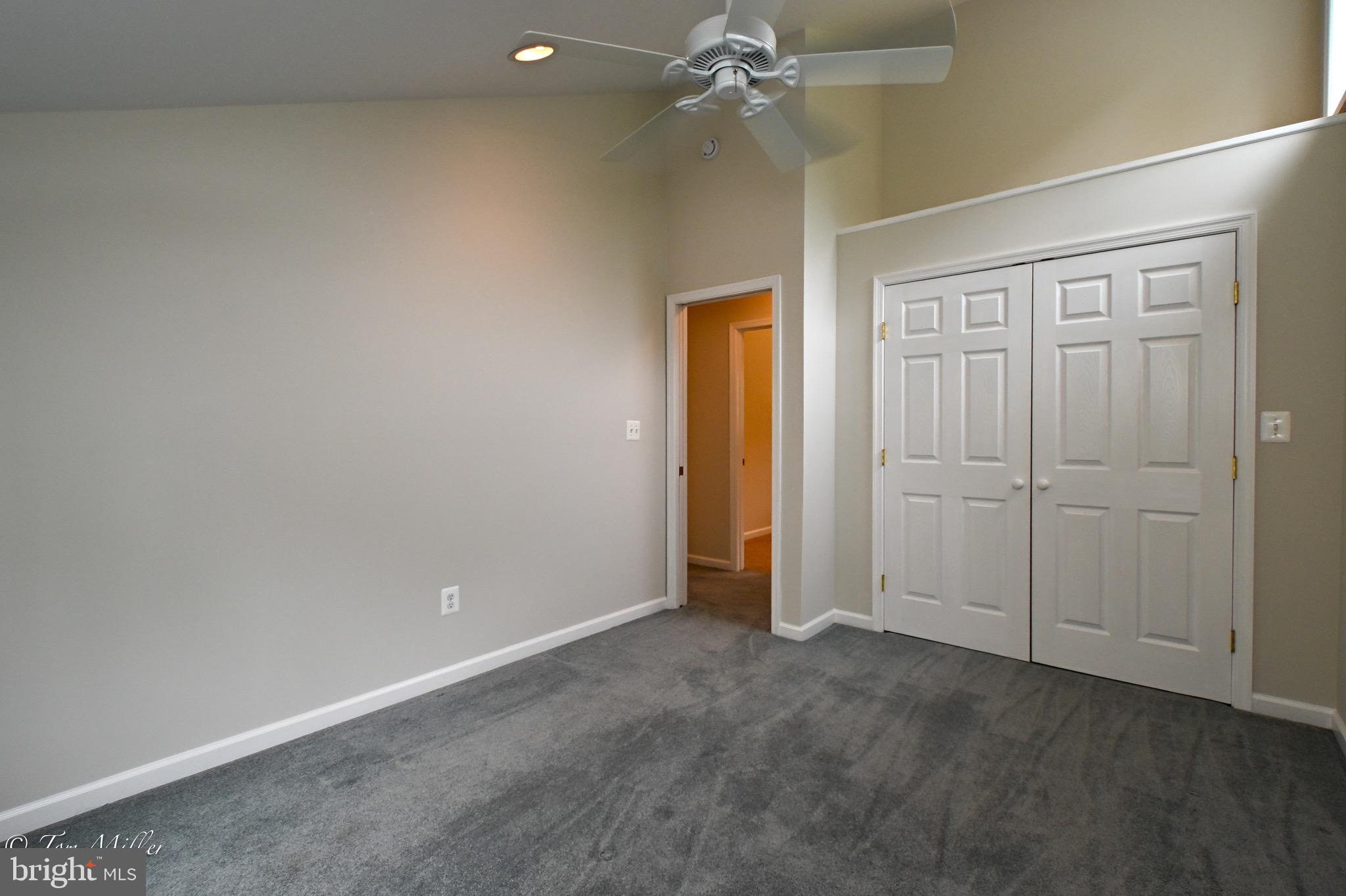 1135 Beech Drive Baltimore, MD 21220 - Photo 40 of 53 an empty room with closet and fan