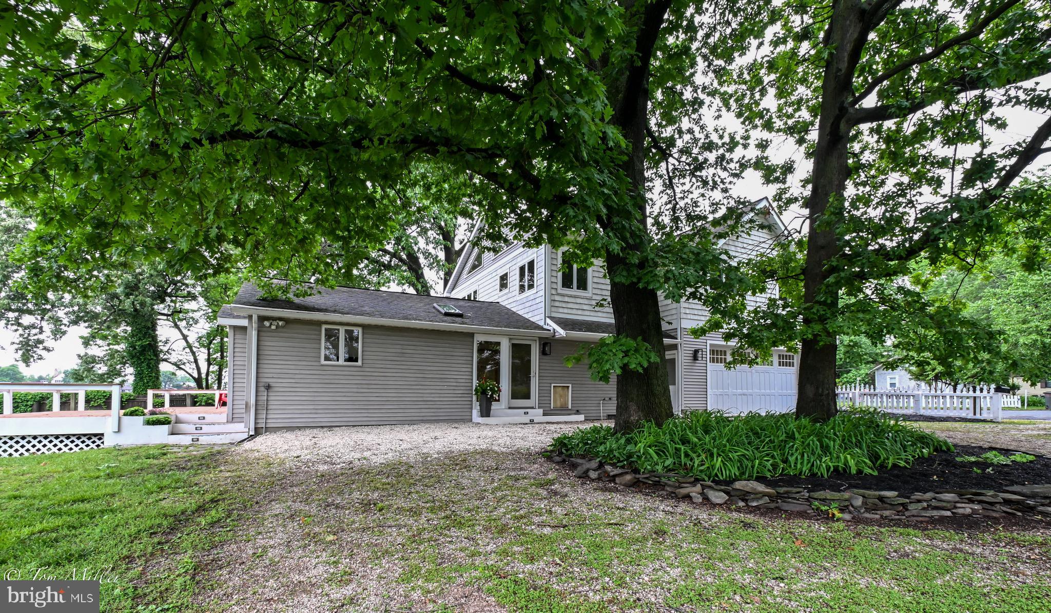 1135 Beech Drive Baltimore, MD 21220 - Photo 50 of 53 a front view of a house with a garden