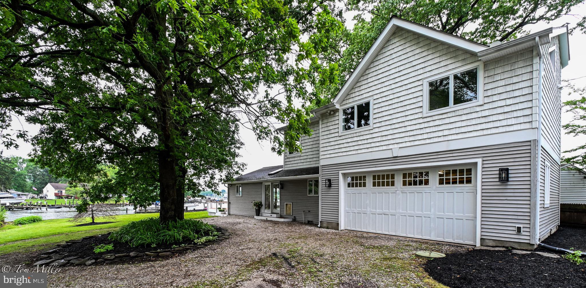 1135 Beech Drive Baltimore, MD 21220 - Photo 53 of 53 a front view of a house with a garden