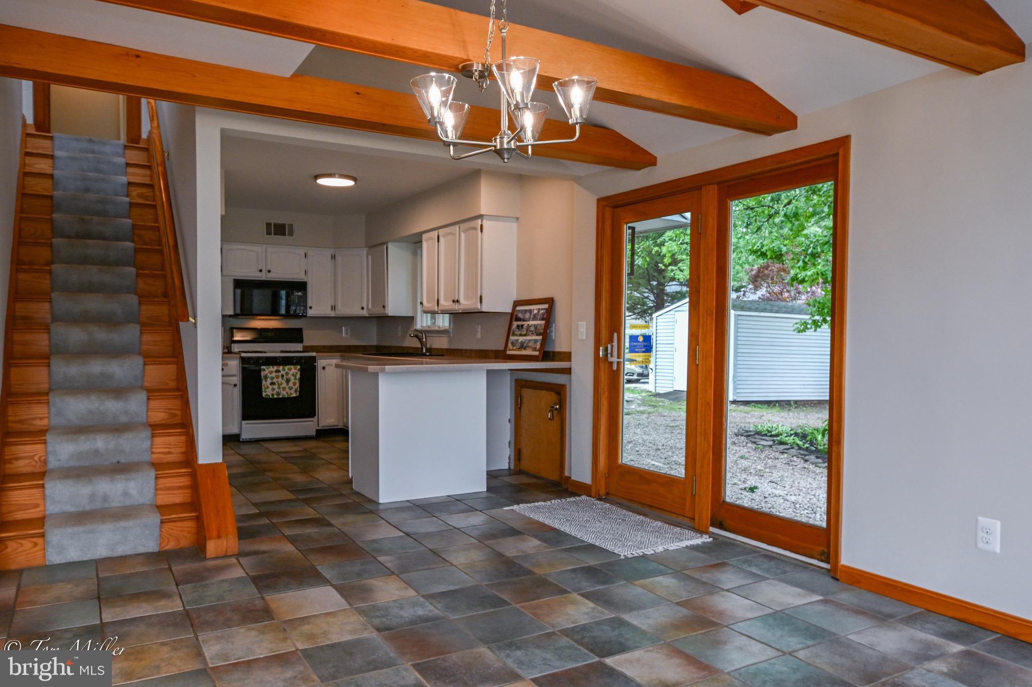 1135 Beech Drive Baltimore, MD 21220 - Photo 9 of 53 a kitchen with stainless steel appliances granite countertop a stove and a refrigerator