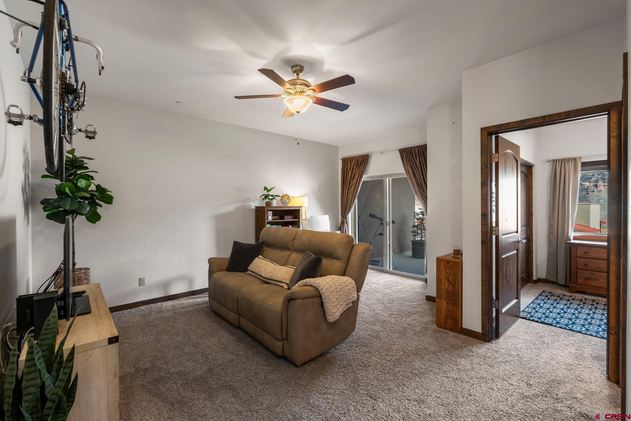 1422 Animas View Drive, Unit 25 Durango, CO 81301 - Photo 19 of 35 a living room with furniture and a potted plant