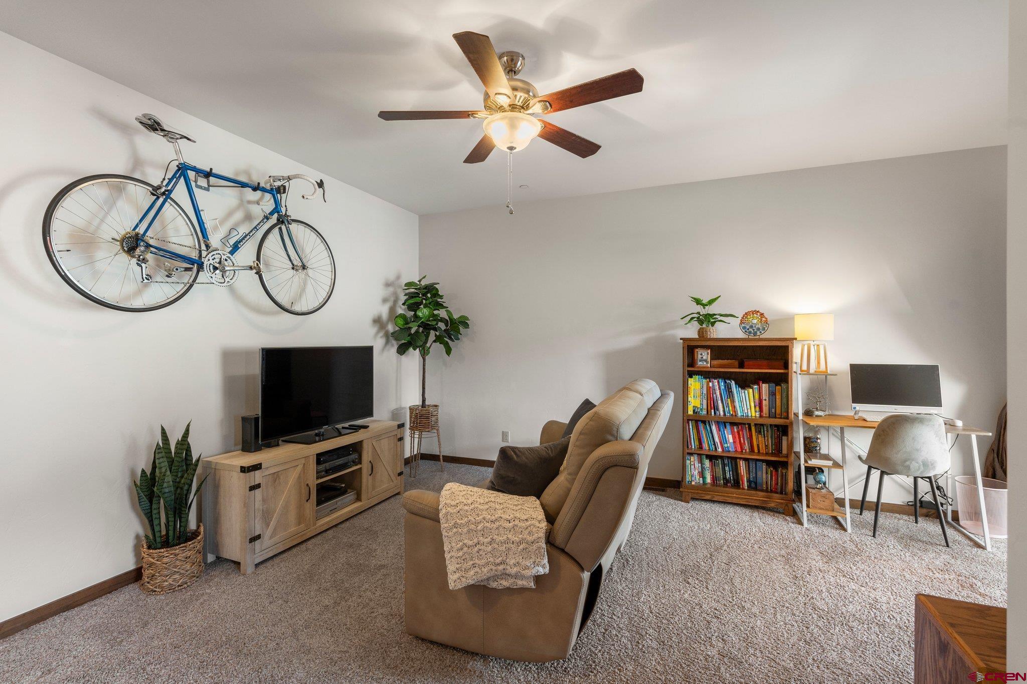 1422 Animas View Drive, Unit 25 Durango, CO 81301 - Photo 20 of 35 a living room with furniture and a flat screen tv